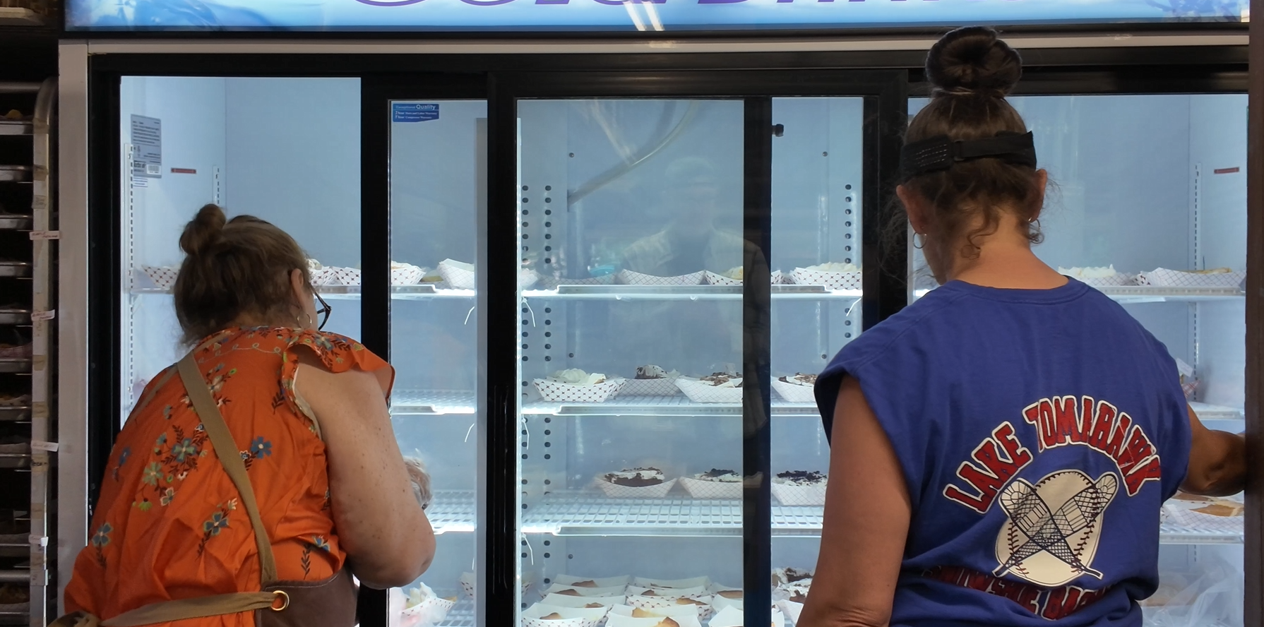 women at food cooler
