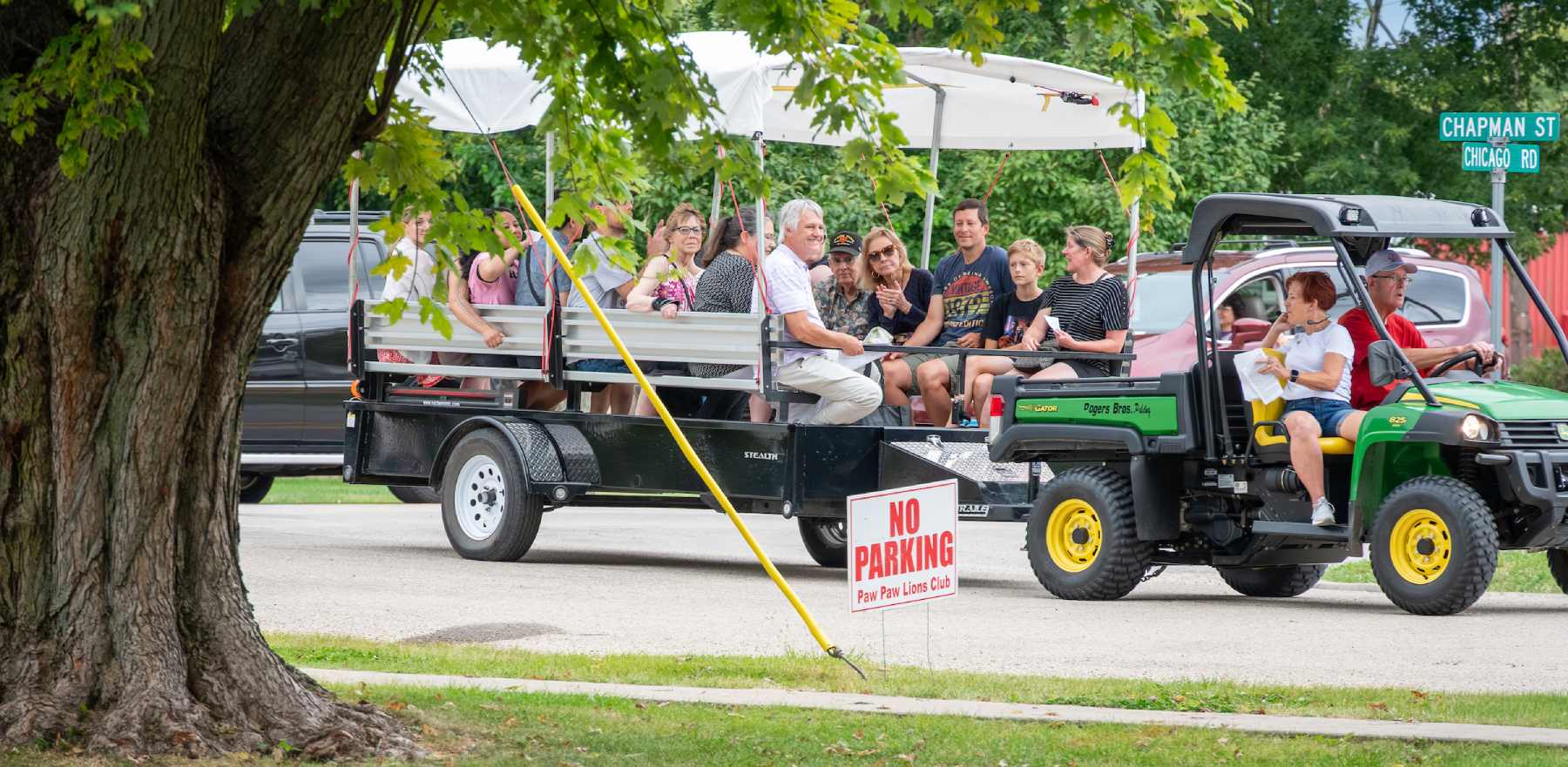 people sitting on a trailer