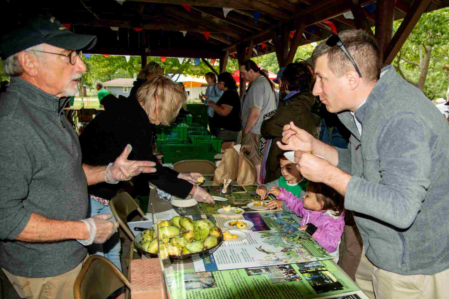 man tasting pawpaw fruit